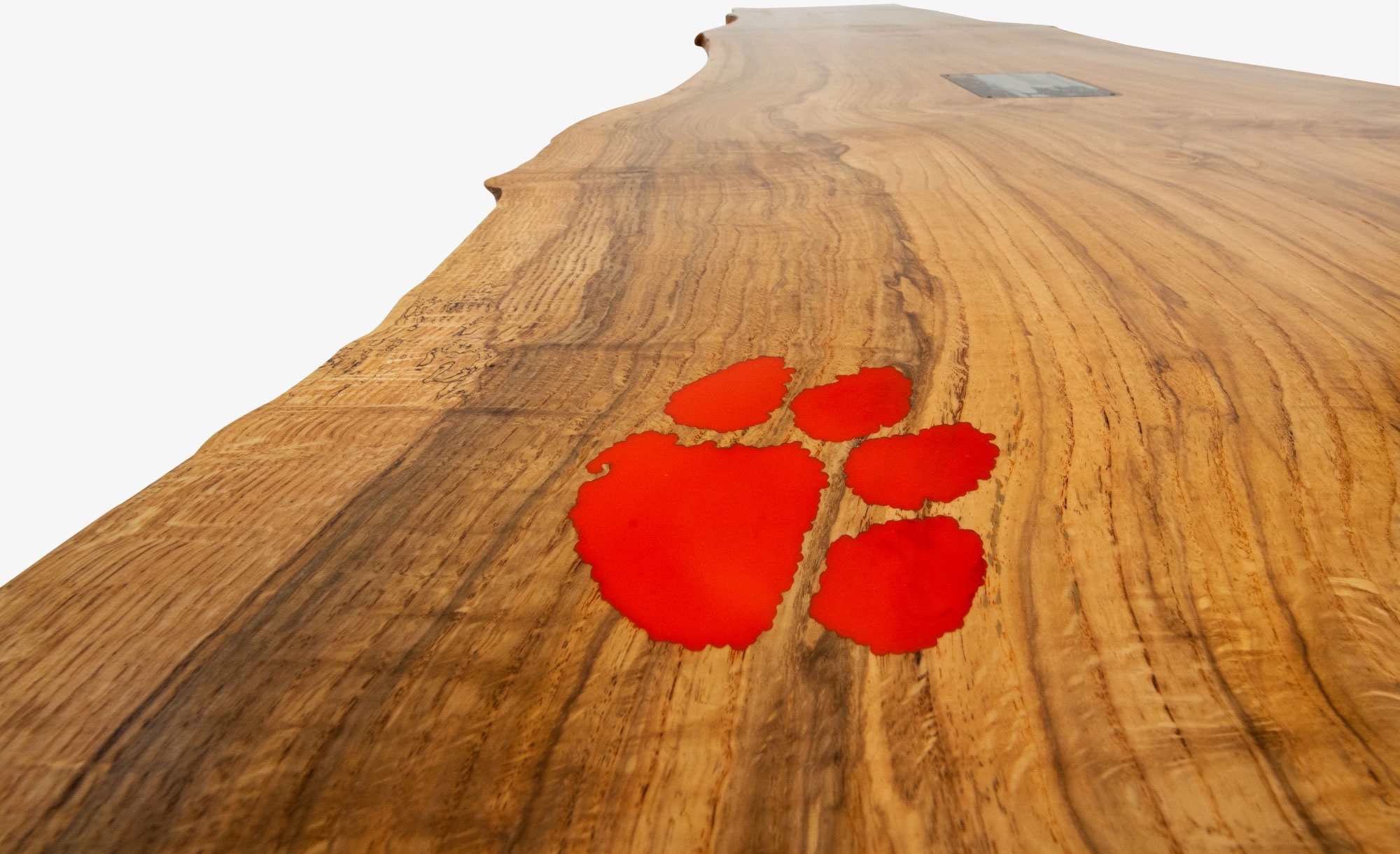 Up-close view of tabletop with tiger paw inlay