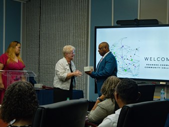 Among the parting gifts was a commemorative watch presented to Gatling by Trustee Jean Matthews with Interim Trustee Chair Jeri Pierce looking on.